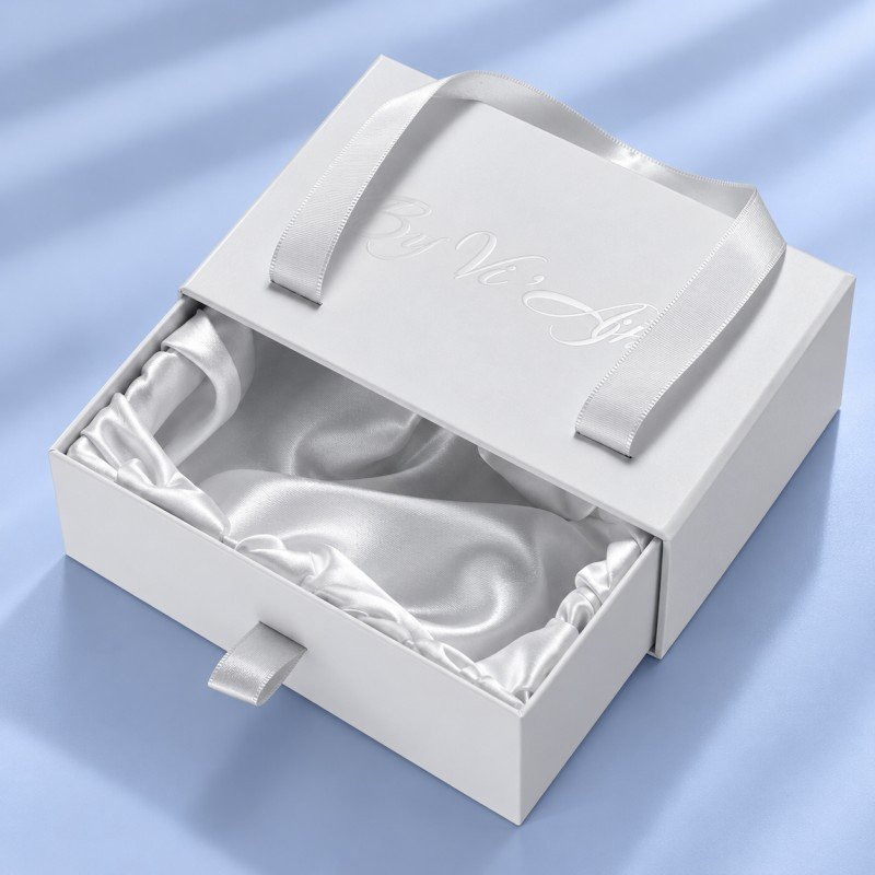 Fabric wrapped insert inside luxury jewelry drawer box